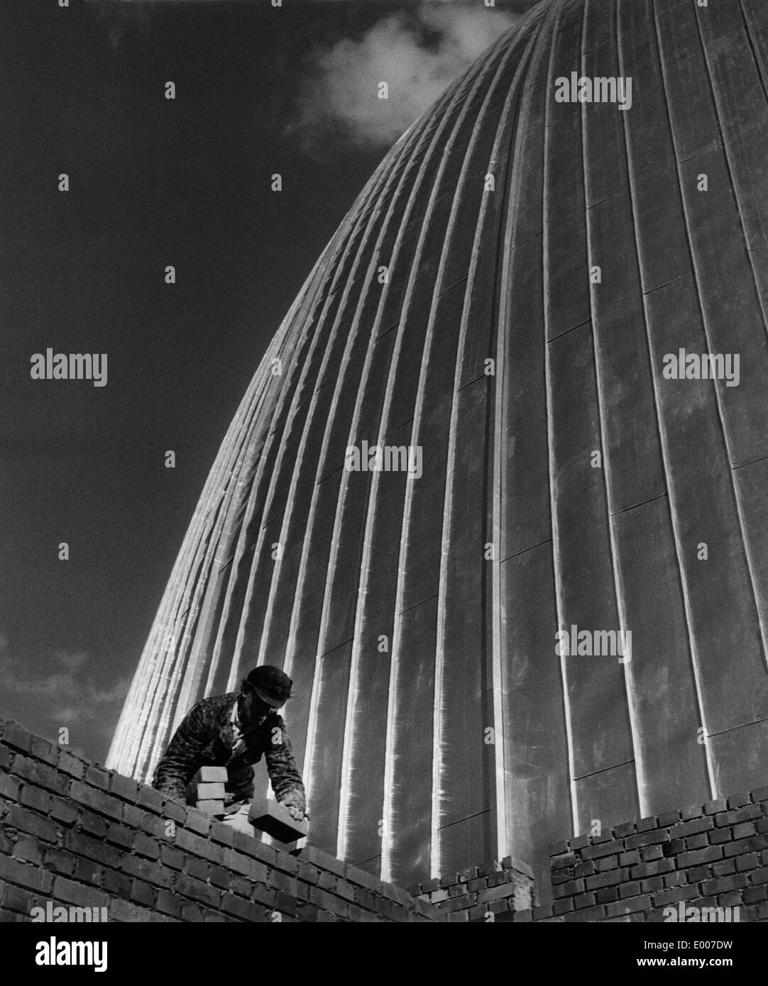 A bricklayer in front of the nuclear research reactor of Garching Stock Photo