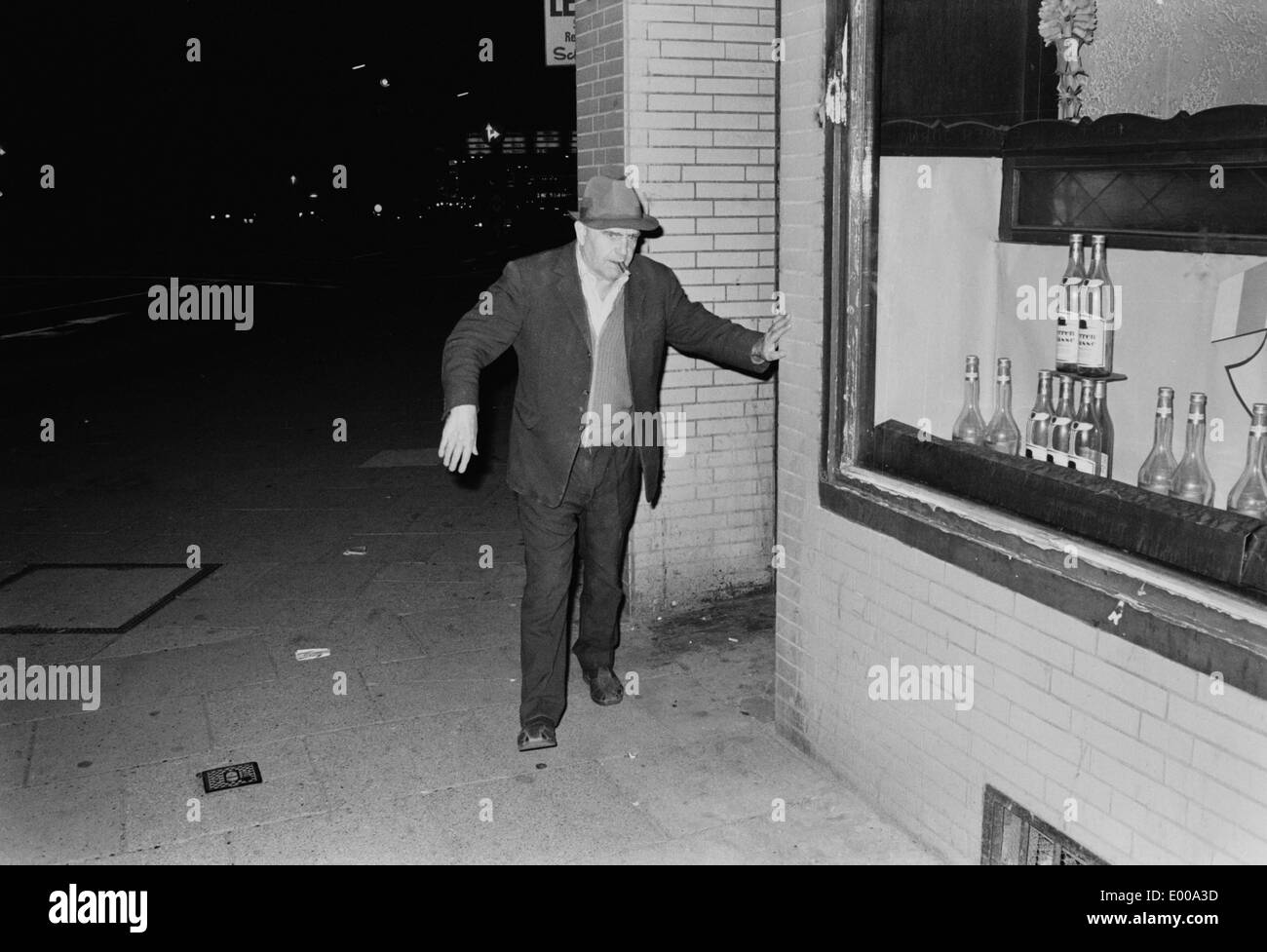 A drunkard on the street Stock Photo