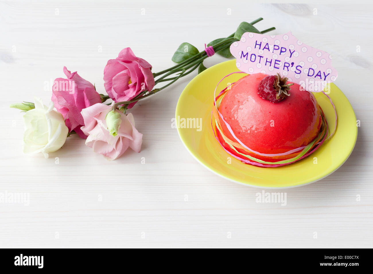 Flowers and a little cake for Mother's Day Stock Photo
