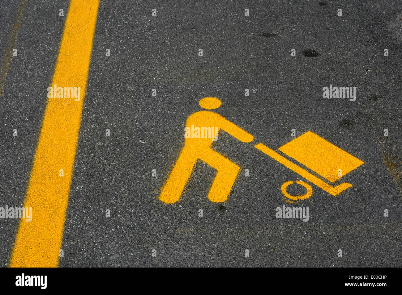 yellow parking symbol on the asphalt,signaling a loading and unloading area Stock Photo