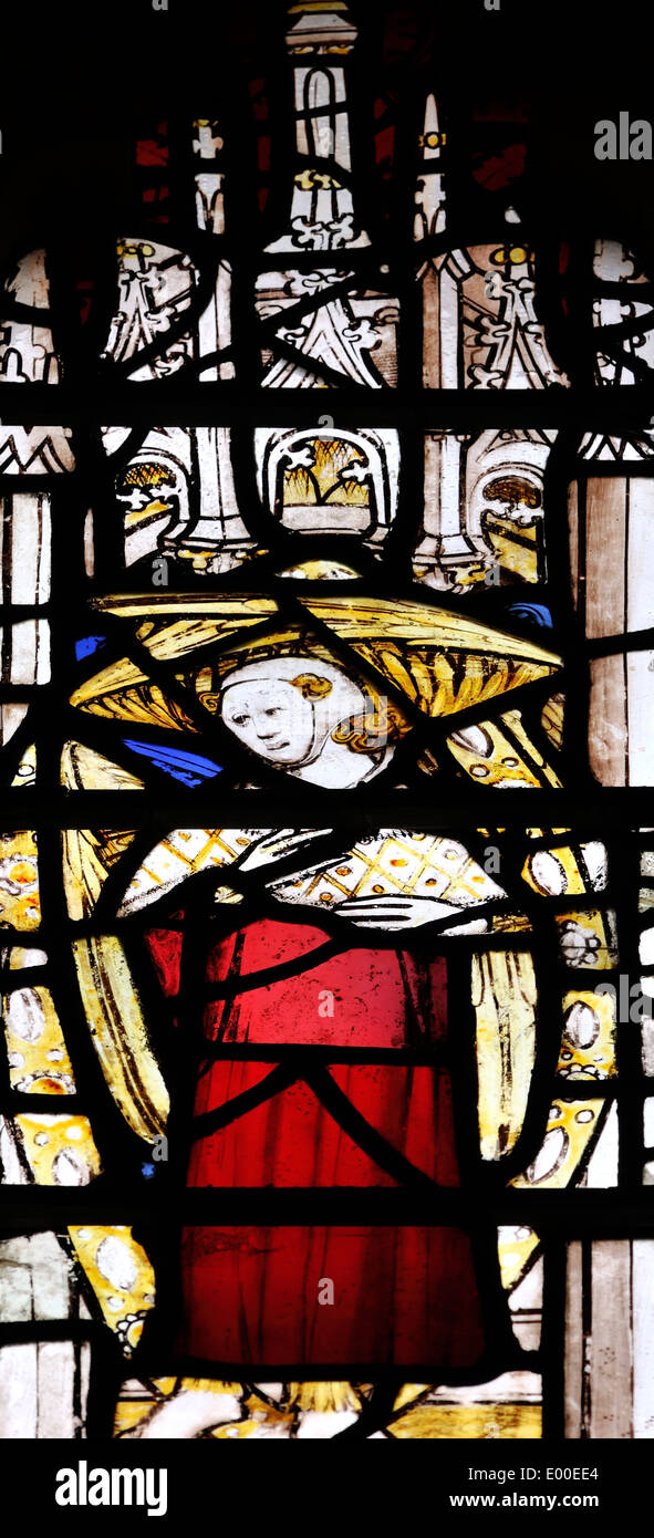 Medieval panel depicting Mary holding Jesus, wrapped in swaddling