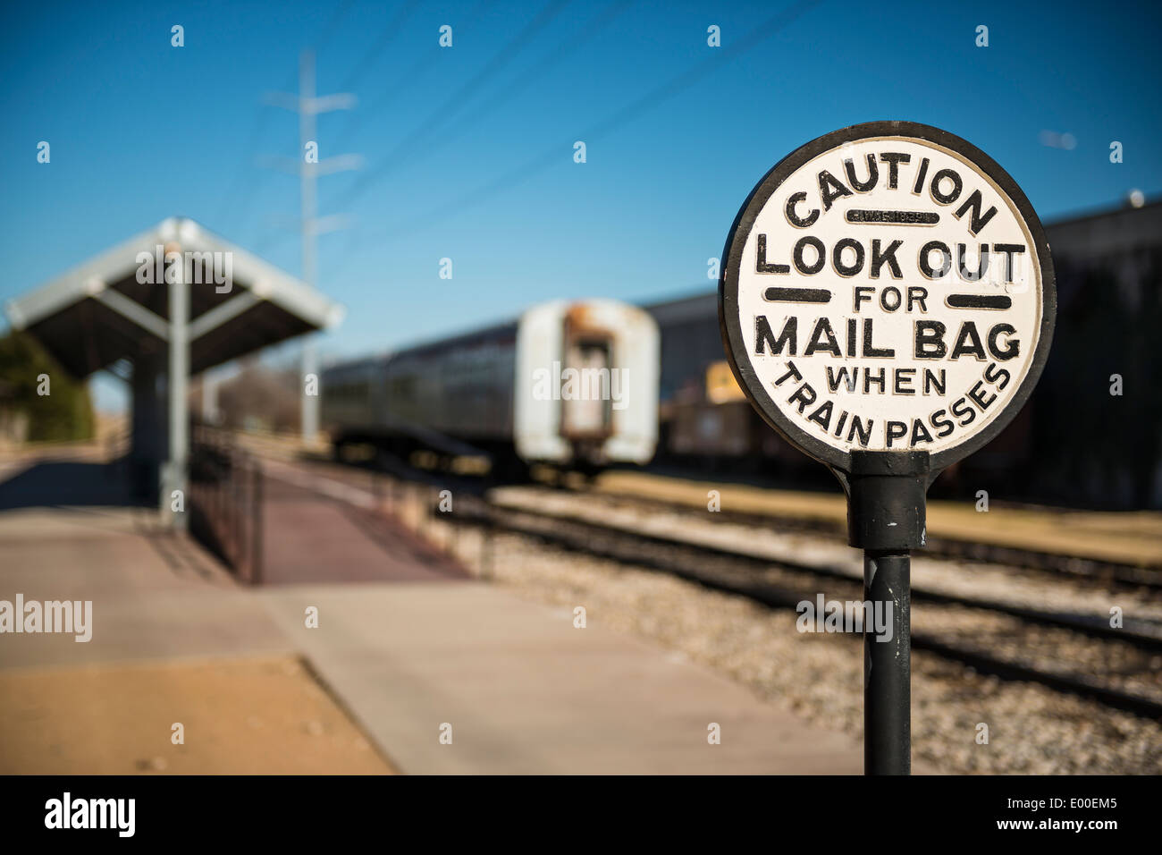 Old rail sign warning of passing mail bags on trains. Stock Photo