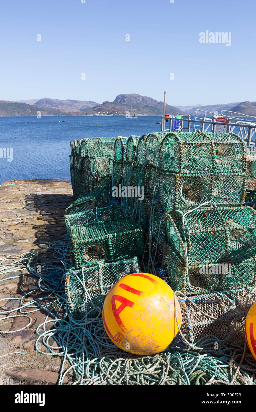 Lobster Pots Stacked on the Pier at Plockton Harbour Scotland UK Stock Photo