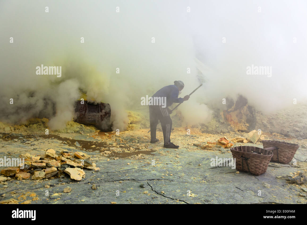 Sulfur mining operation at Kawah Ijen, Banyuwangi Regency, East Java, Indonesia Stock Photo