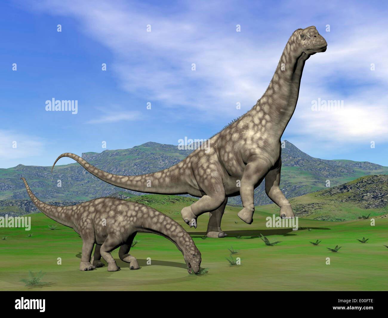 Mother Argentinosaurus dinosaur and baby grazing a green landscape. Stock Photo