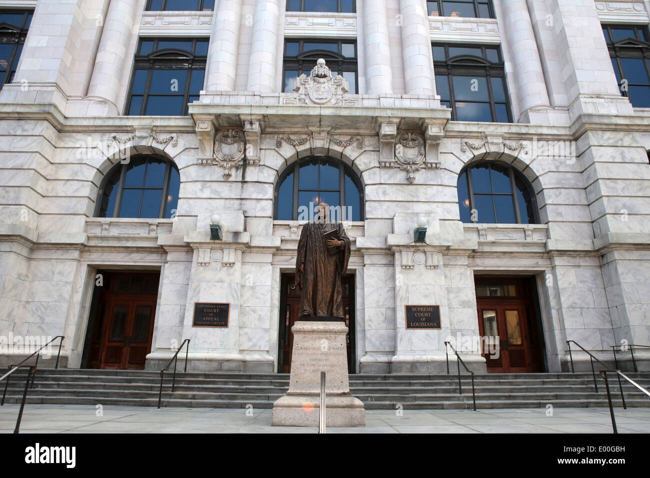 Panoramic image of Louisiana Supreme Court building with statue of