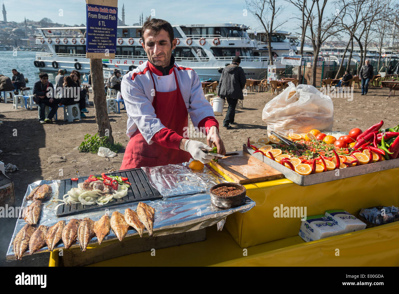 Preparing grilled mackerel sandwiches at a stall on Karakoy waterfront