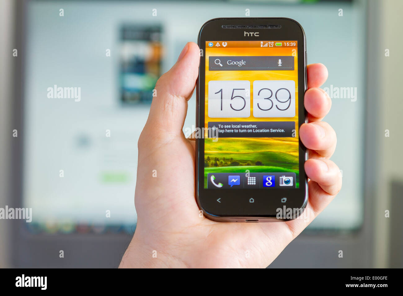 Hand holding an HTC One SV features a 4.3-inch Stock Photo