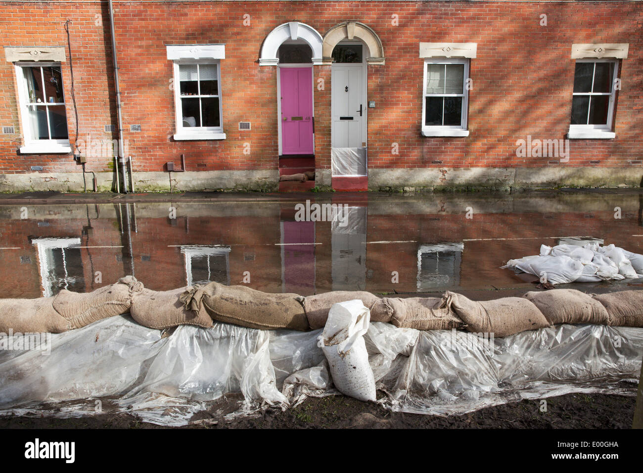 Flooded street in Winchester, Hampshire, England, UK. Flooding is becoming more frequent with climate change. Stock Photo