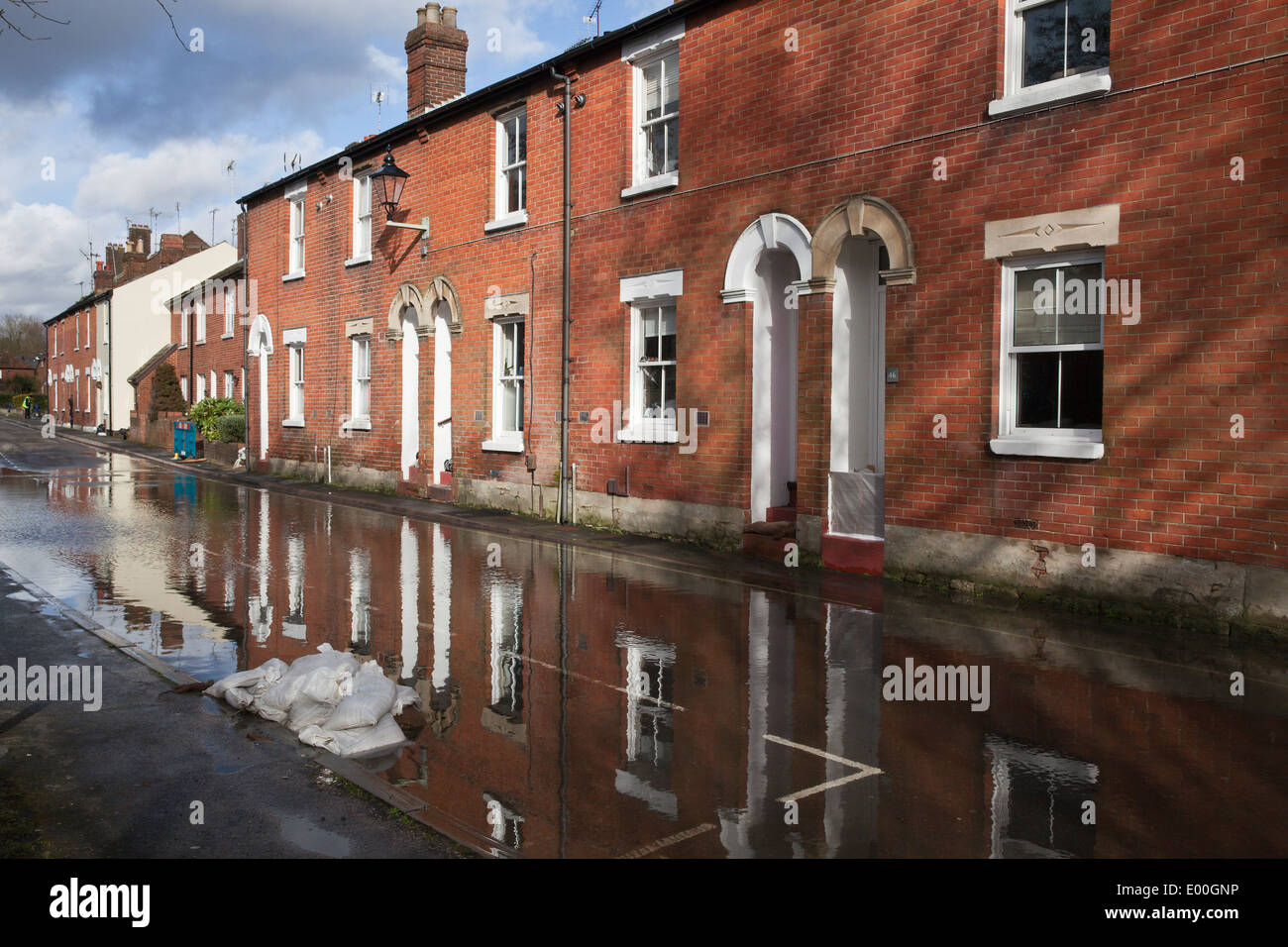 Flooded street in Winchester, Hampshire, England, UK. Flooding is becoming more frequent with climate change. Stock Photo