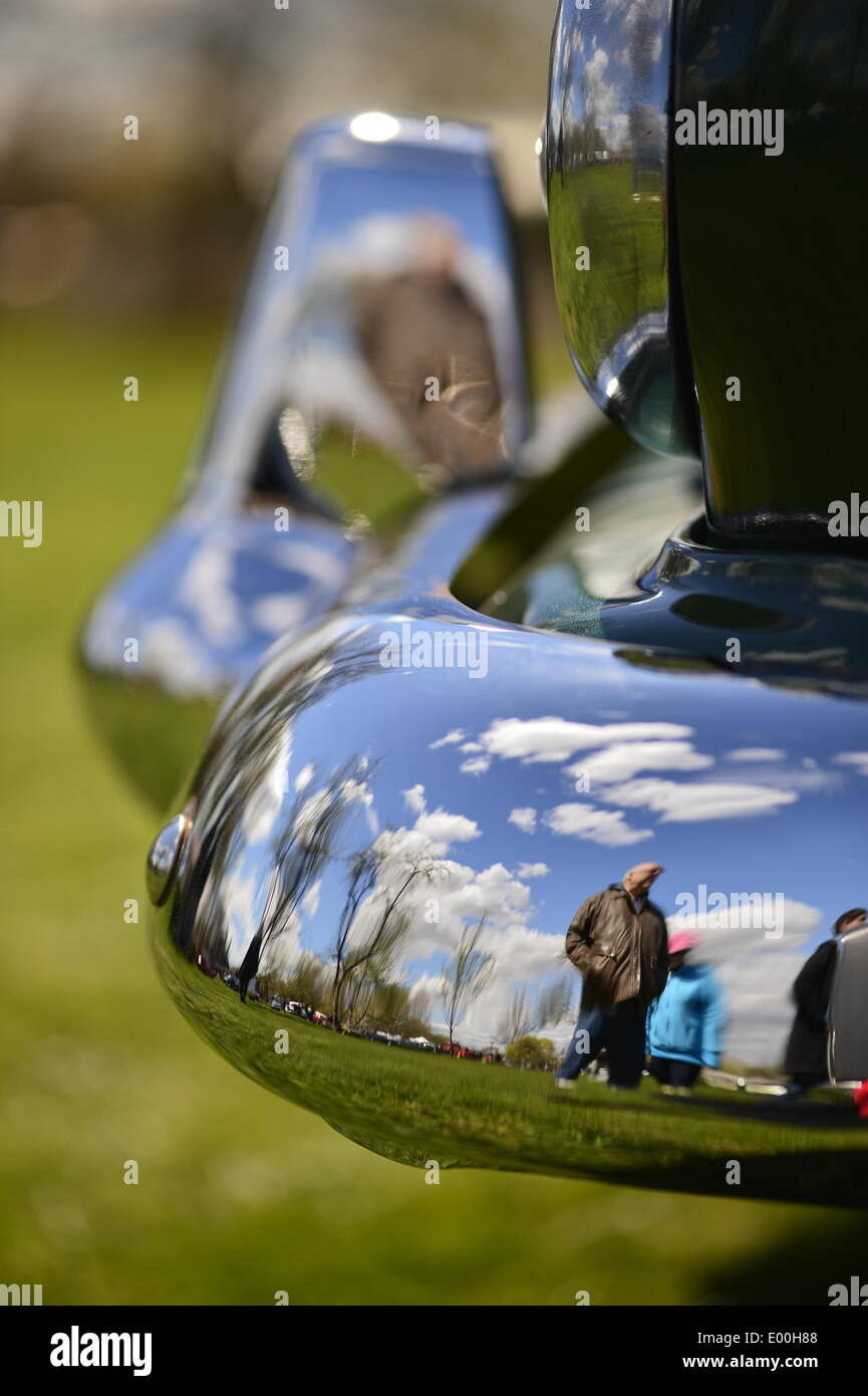 Floral Park, New York, U.S. 27th April, 2014. A green 1953 Dodge Coronet Diplomat front chrome upright and bumper reflect visitors and beautiful blue sky  at the 35th Annual Antique Auto Show at Queens Farm. Credit:  Ann E Parry/Alamy Live News Stock Photo