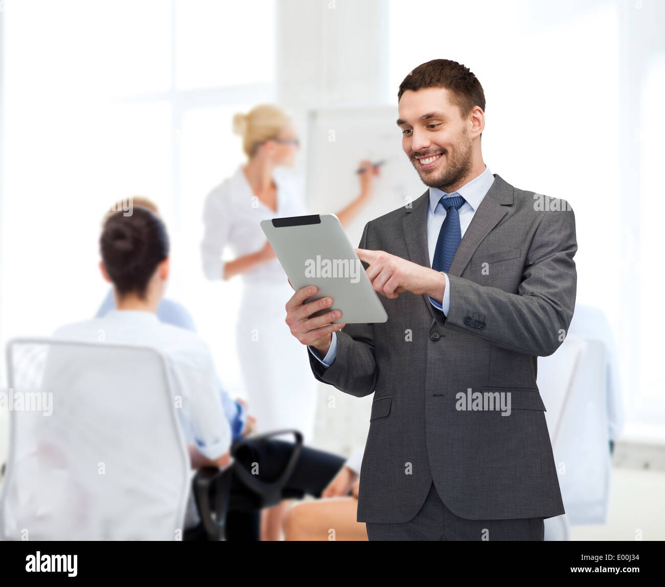 smiling buisnessman with tablet pc computer Stock Photo