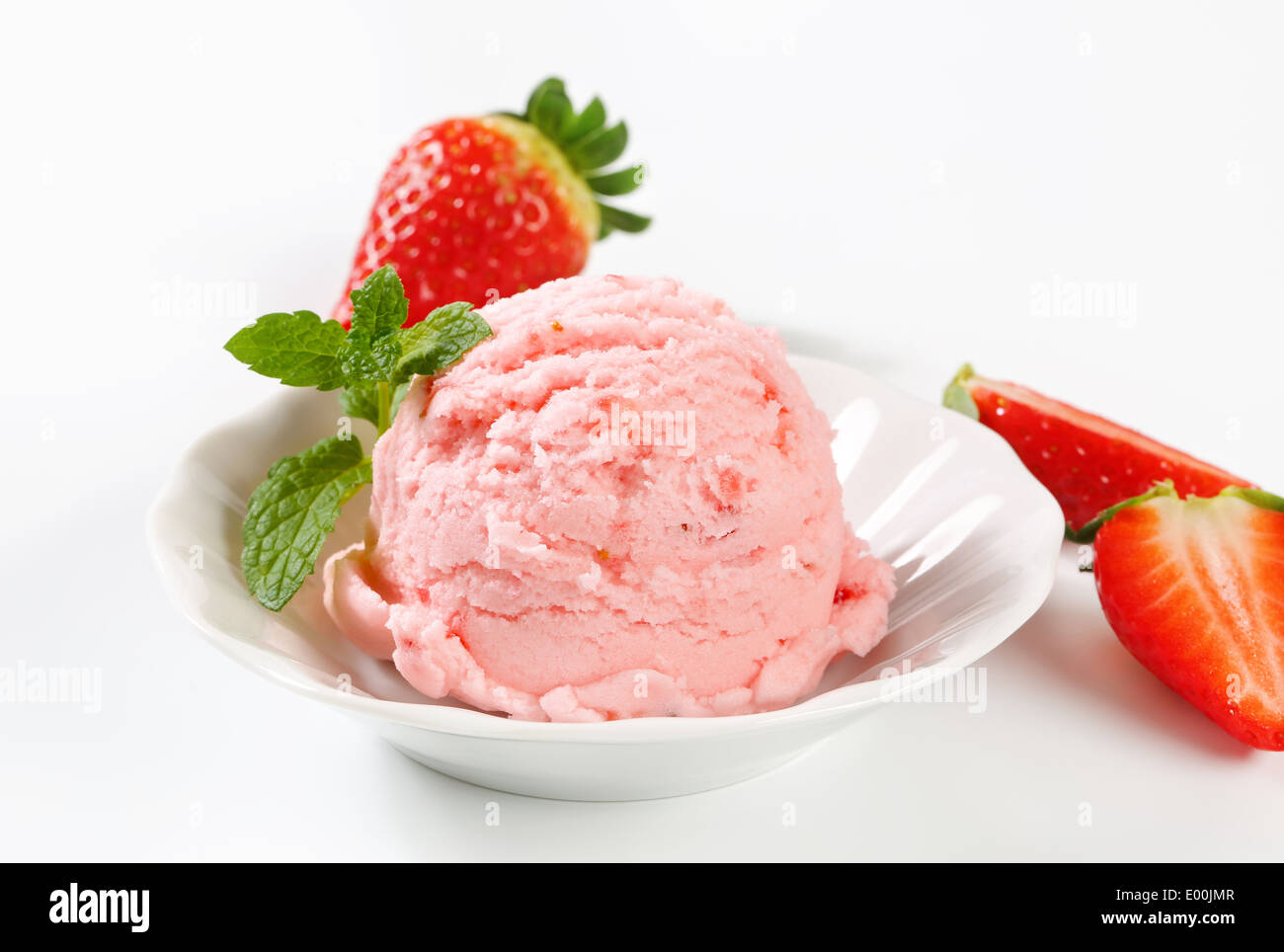 Scoop of ice cream with fresh strawberries Stock Photo