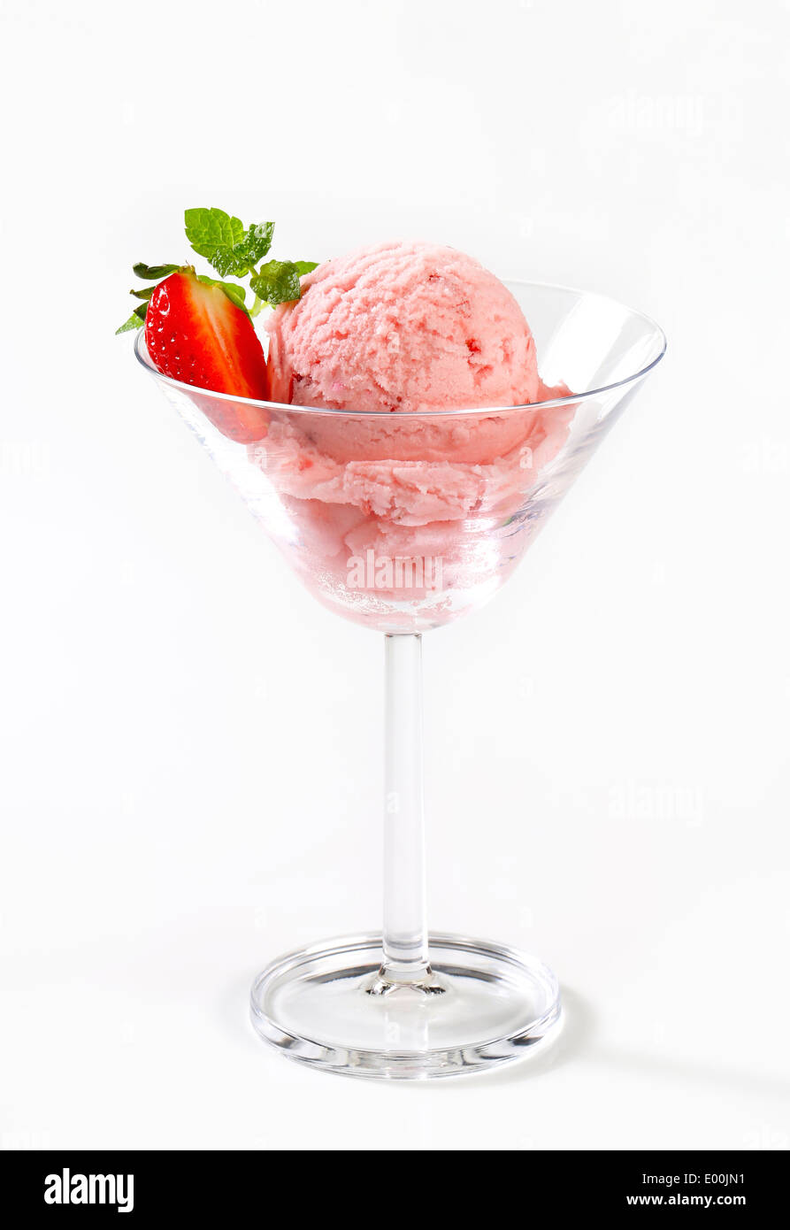 Scoop of strawberry ice cream in stemmed glass Stock Photo
