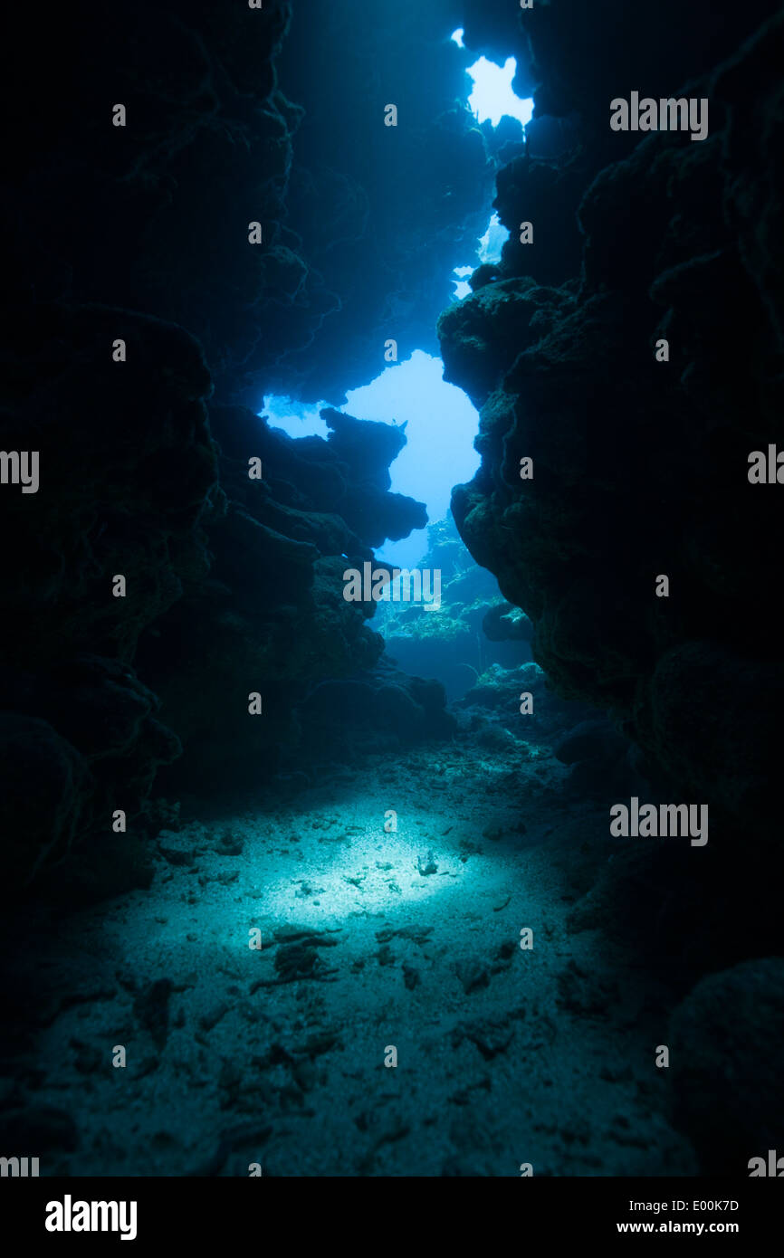 A rocky chasm at Mary's Place Dive Site in Roatan, Honduras Stock Photo ...