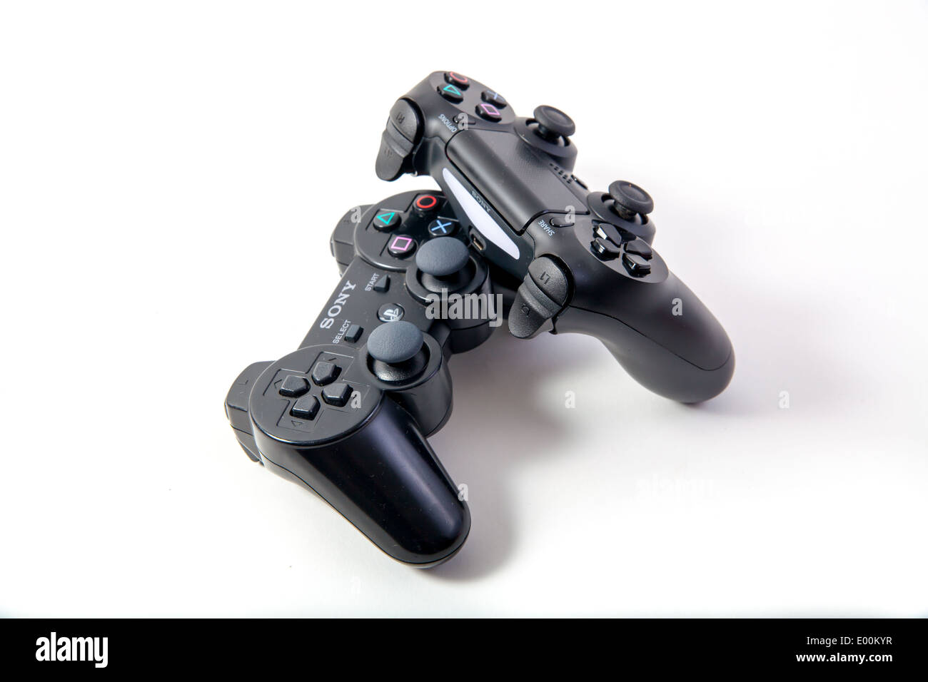 Sony Playstation 3 and 4 original authentic black gaming controllers on a  white studio background Stock Photo - Alamy