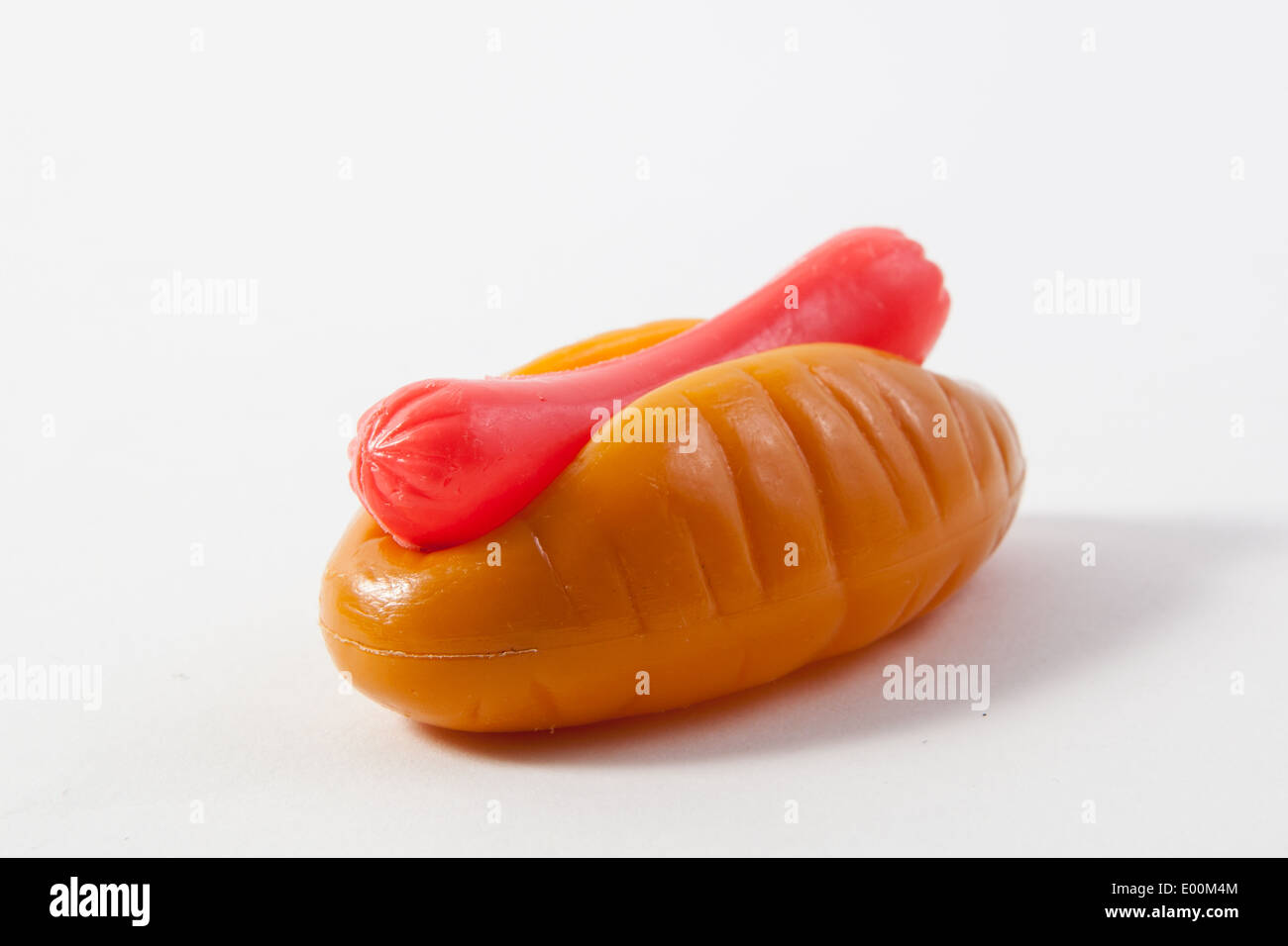 A pretend food hot dog and bread bun for make believe and pretend play in the kitchen by young children, toddlers and babies Stock Photo