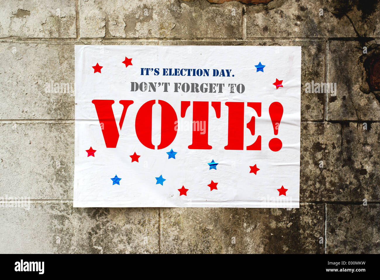 Election day poster reminding you to Vote on grunge street wall Stock Photo