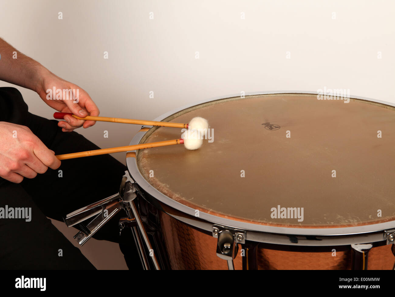 Timpani player playing in the correct playing area of a calfheaded drum to produce the best