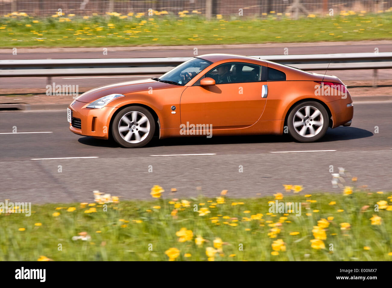 A Nissan 350Z [Fairlady Z Z33”] sports car travelling along the Kingsway West Dual Carriageway in Dundee, UK Stock Photo