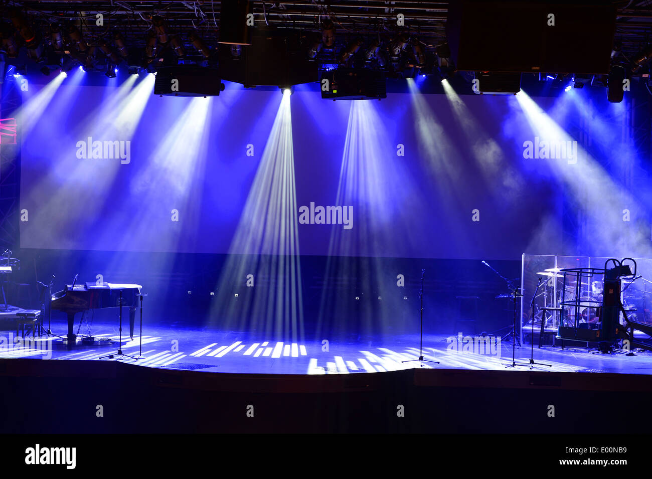Stage with light beams and piano Stock Photo Alamy