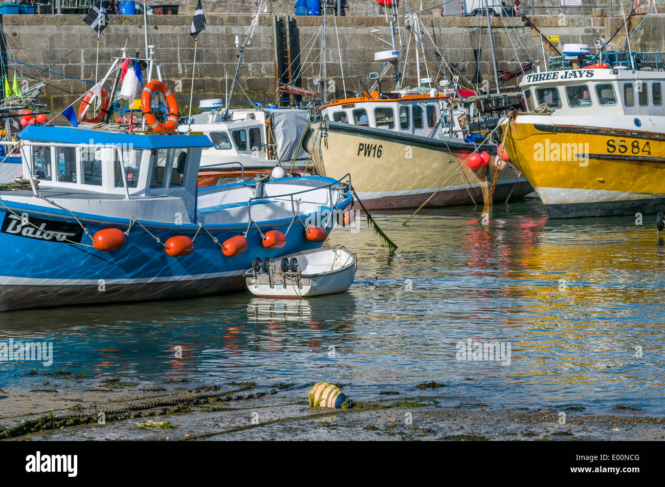 Fishing boats moored in Newquay harbour in Cornwall England Stock Photo