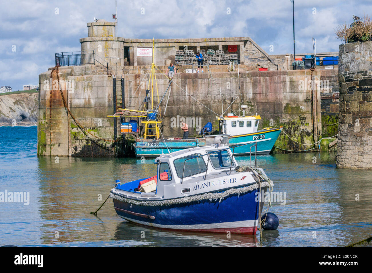 Fishing boats moored in Newquay harbour in Cornwall England Stock Photo
