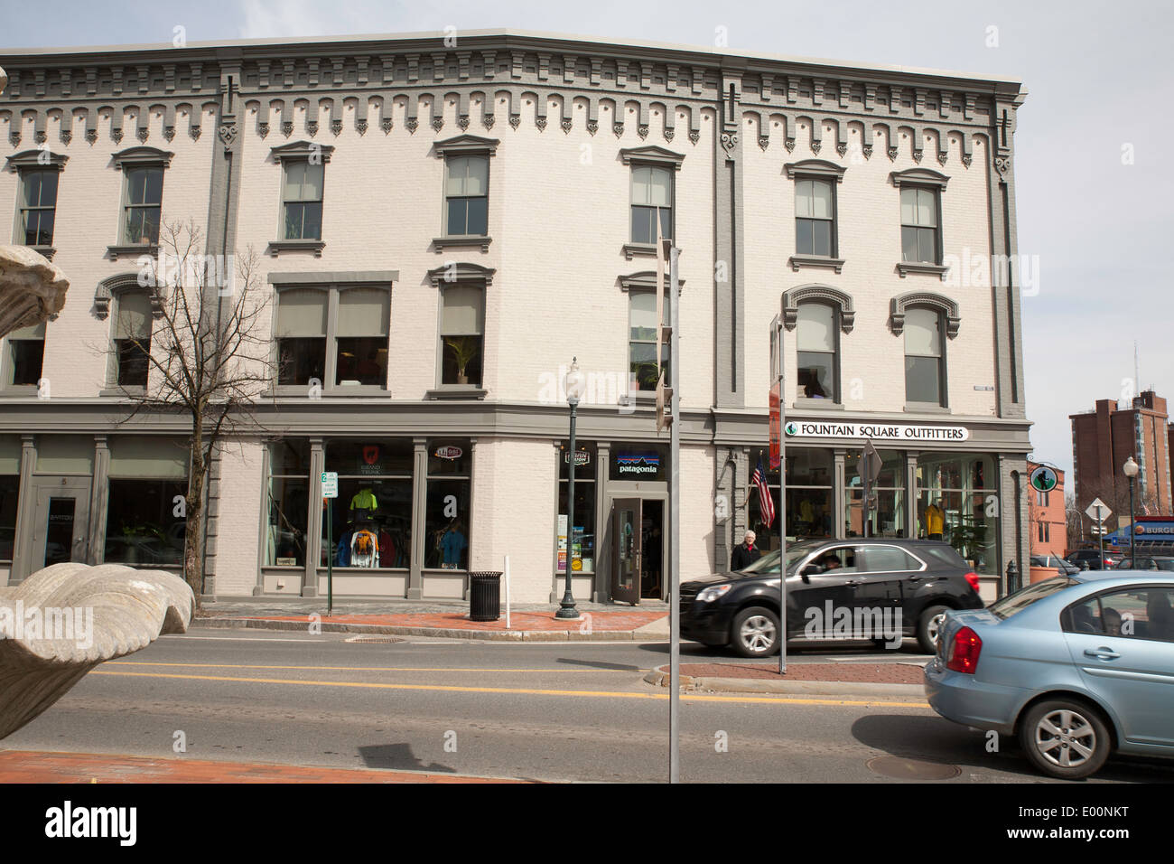 Downtown Glens Falls with afternoon traffic. Block of stores and