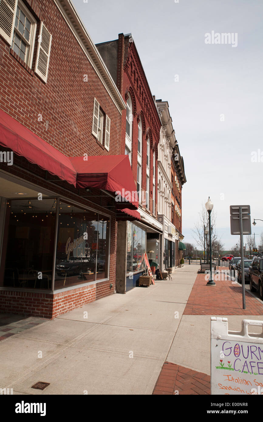 Downtown Glens Falls with little afternoon foot traffic on a block of stores and offices. Stock Photo