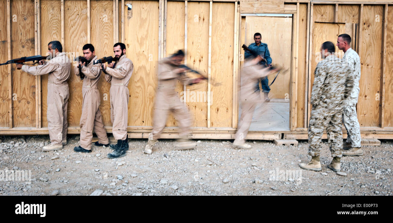 Afghan Uniformed Police practice forced entry and maneuvering at the Joint Sustainment Academy Southwest, Camp Leatherneck August 23, 2014 in Helmand province, Afghanistan. Stock Photo