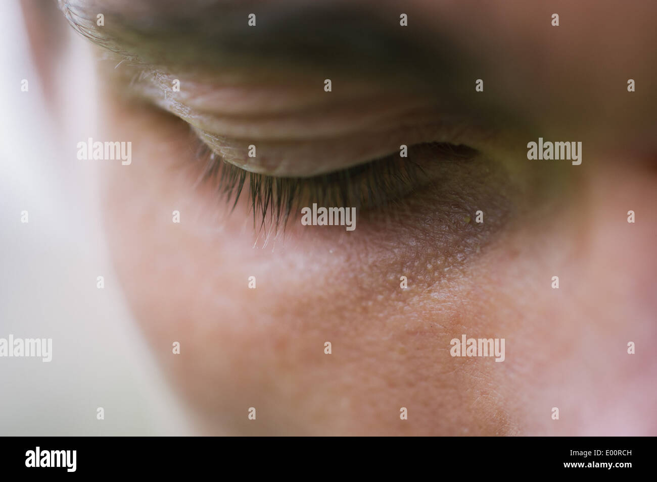 A close-up detail of a man's eye area showing eyelashes. Stock Photo