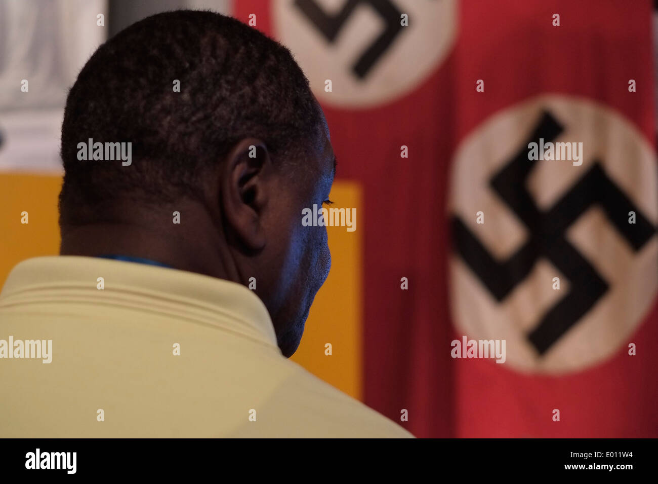 A visitor from Africa views Nazi swastikas in Yad Vashem  Museum for Holocaust in Jerusalem Israel Stock Photo