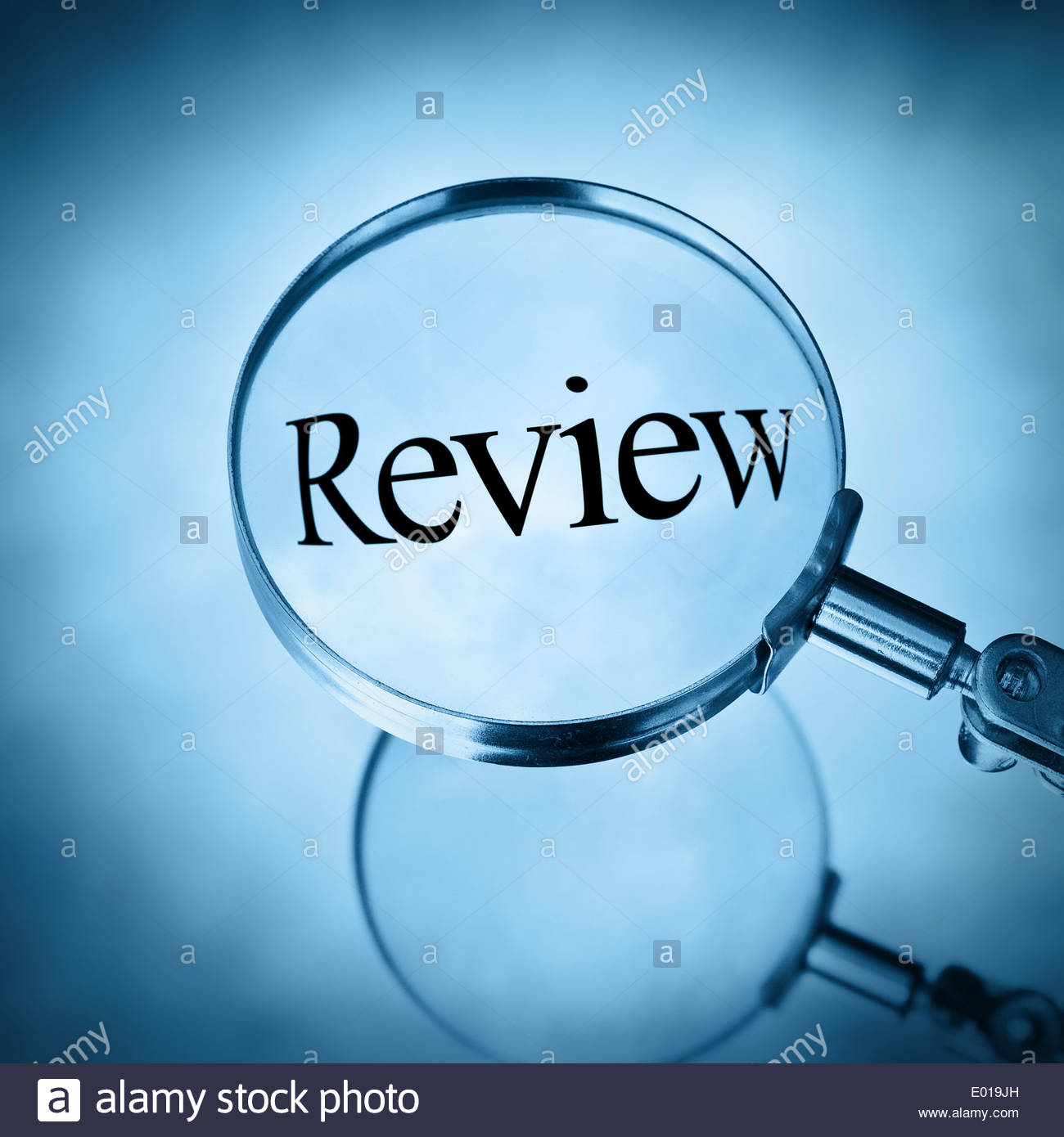 review under magnifying glass Stock Photo, Royalty Free Image: 68871001 ...