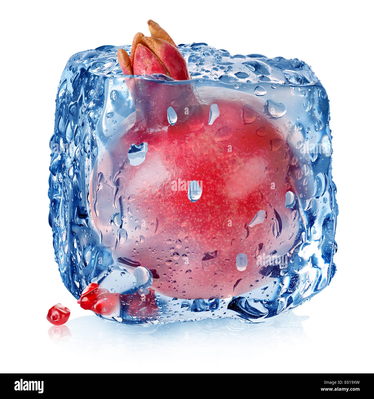 Pomegranate in ice cube isolated on white Stock Photo