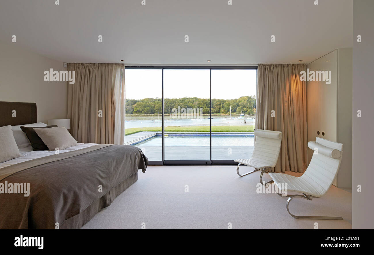 Fishbourne Quay, Wootton Creek, United Kingdom. Architect: The Manser Practice, 2013. Bedroom with a view. Stock Photo