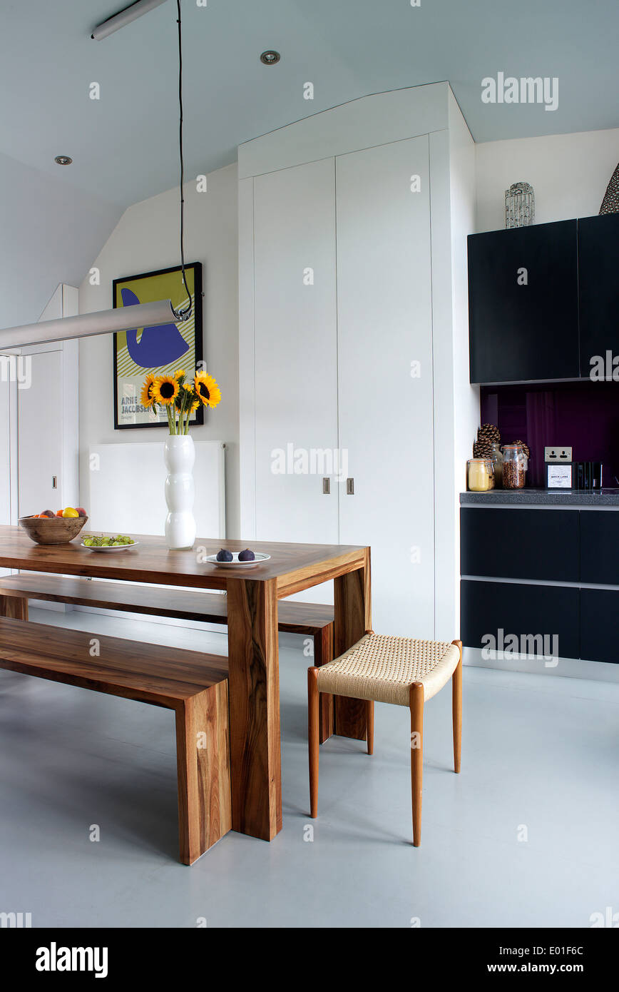 Wooden table and bench seats in modern kitchen Stock Photo Alamy