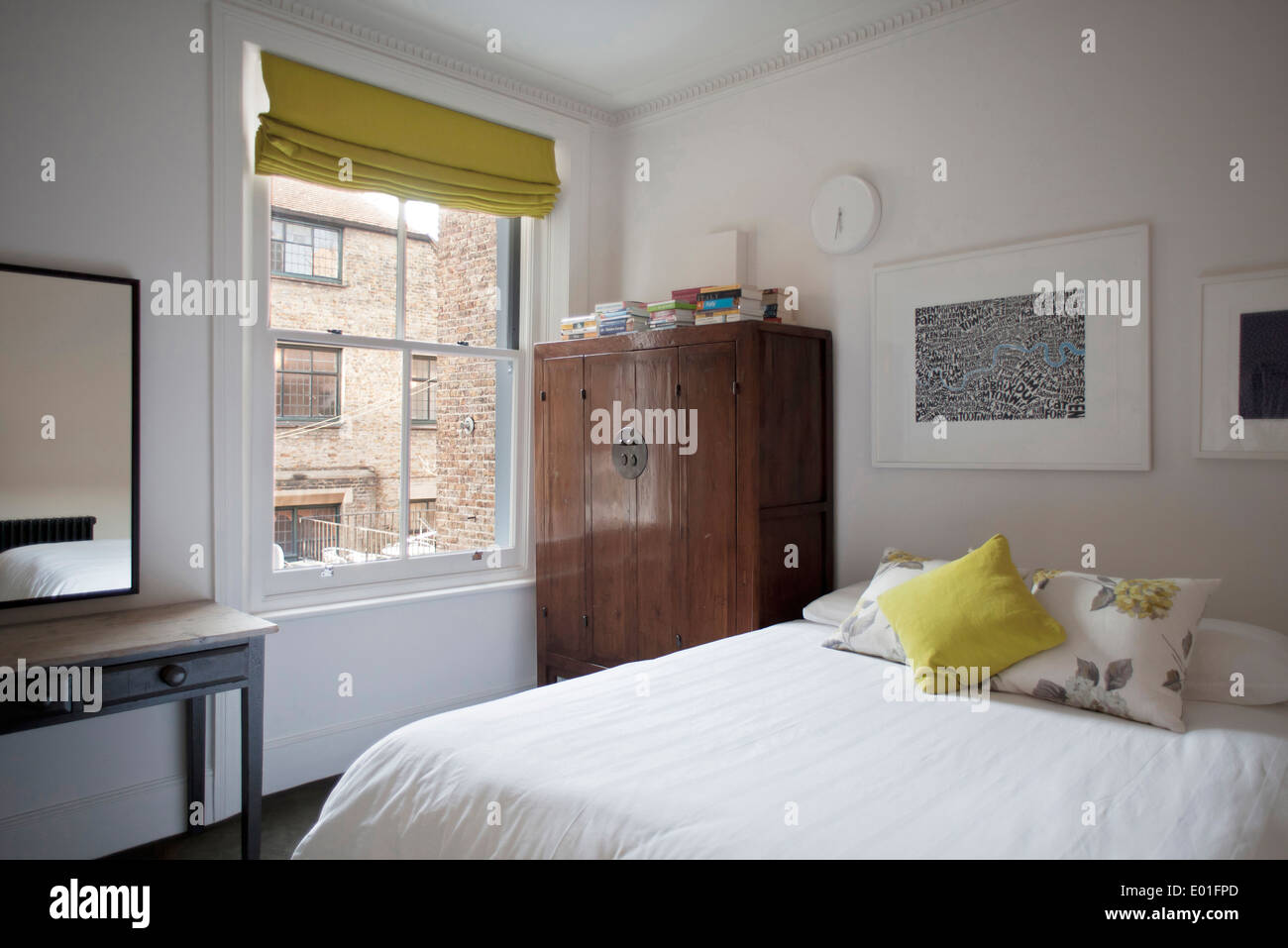 Double bed in traditional style bedroom, Fulham town house, London Stock Photo