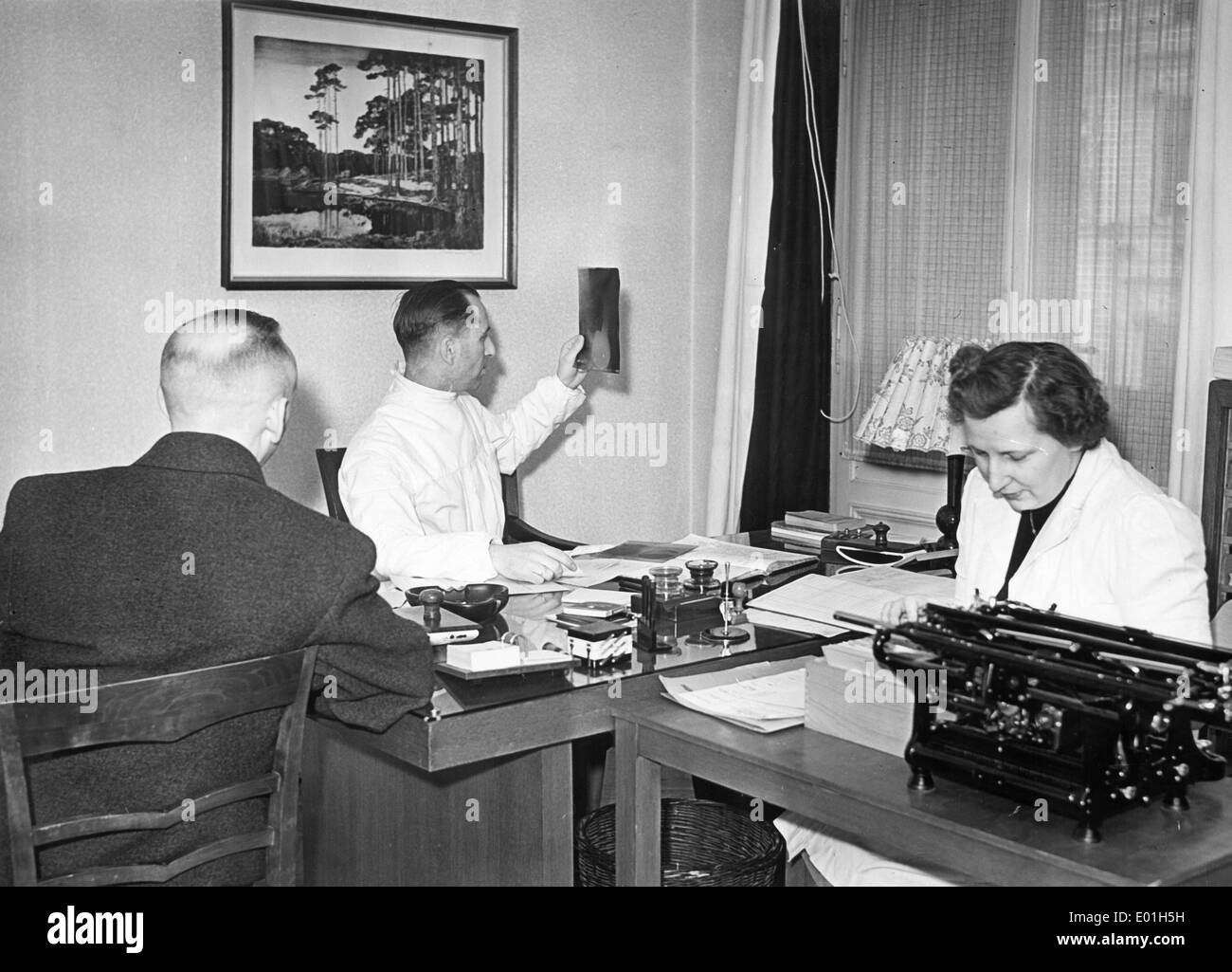 Physician interpreting a radiograph, 1943 Stock Photo