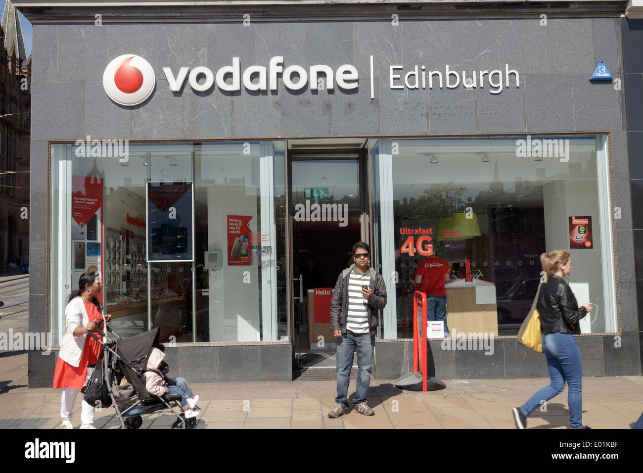 Shoppers outside of the Vodafone mobile phone retailer on Princes