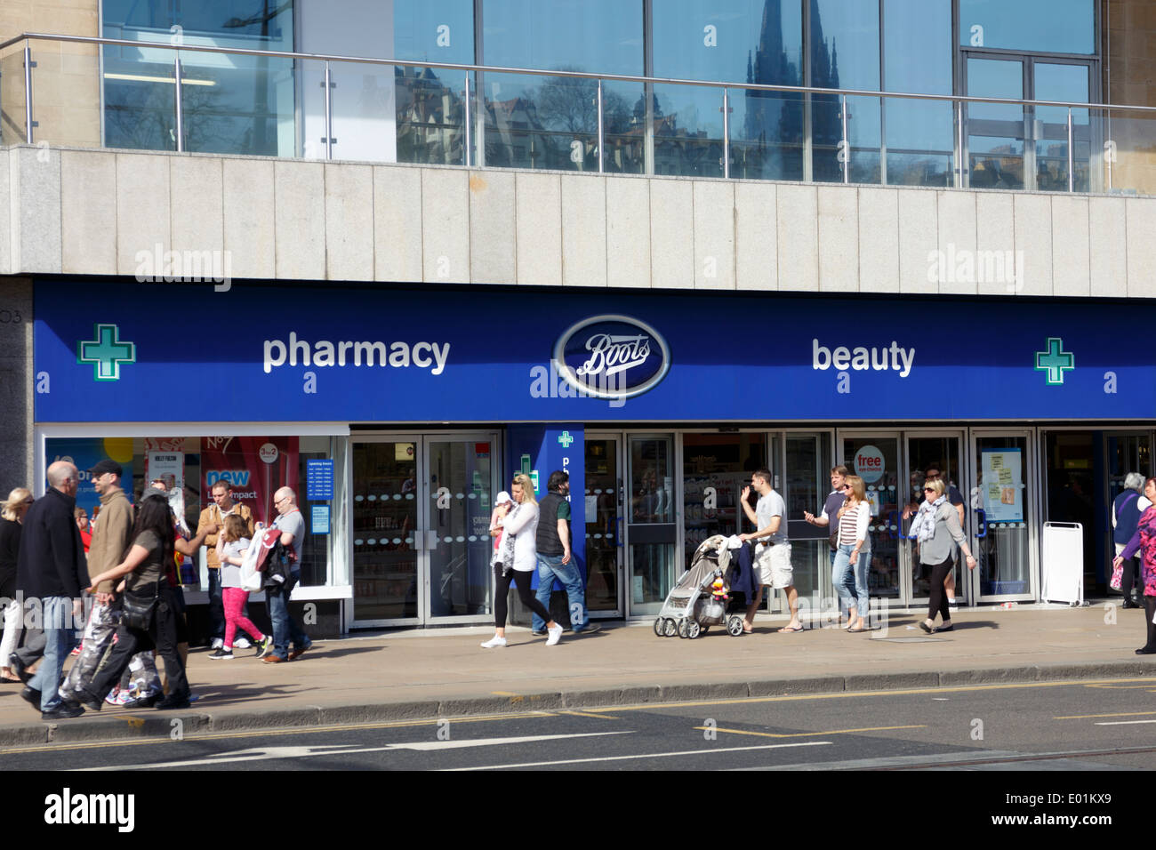 Shoppers outside Boots healthcare store on Princes Street Edinburgh