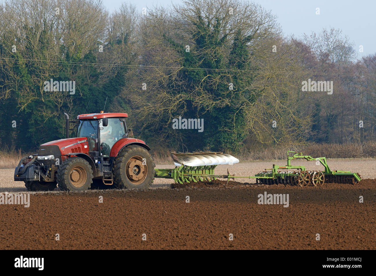 Tractor ploughing with a farrow press attachment Stock Photo Alamy