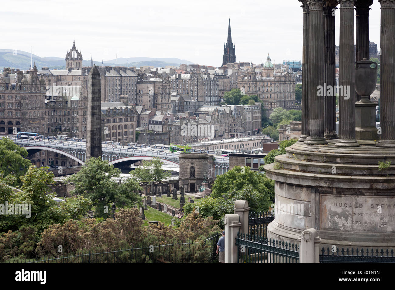 View of Edinburgh Old Town including the North Bridge from Calton Hill. Dugald Stewart Monument in the foreground right. Stock Photo