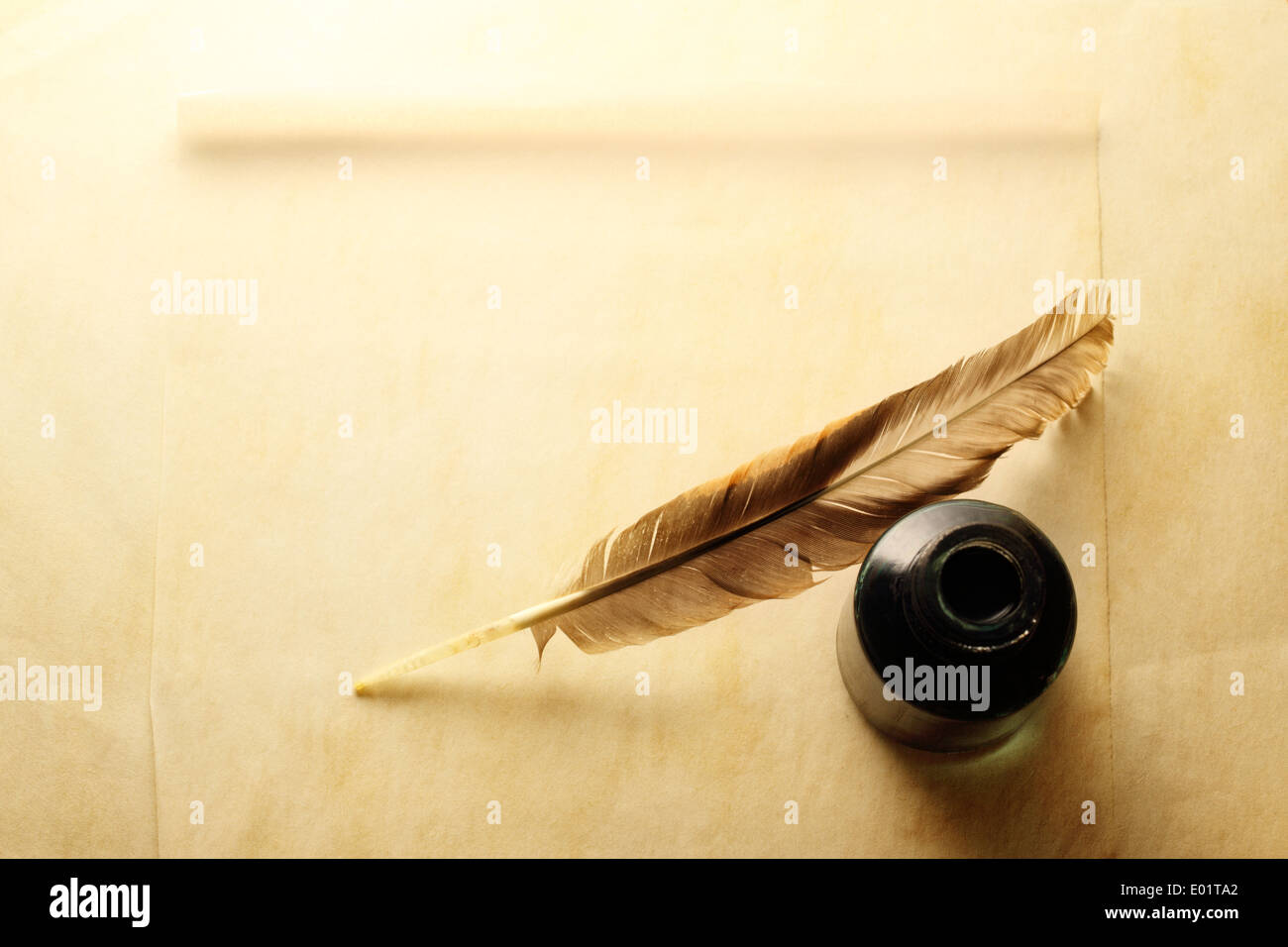 Blank envelope with inkwell and feather Stock Photo