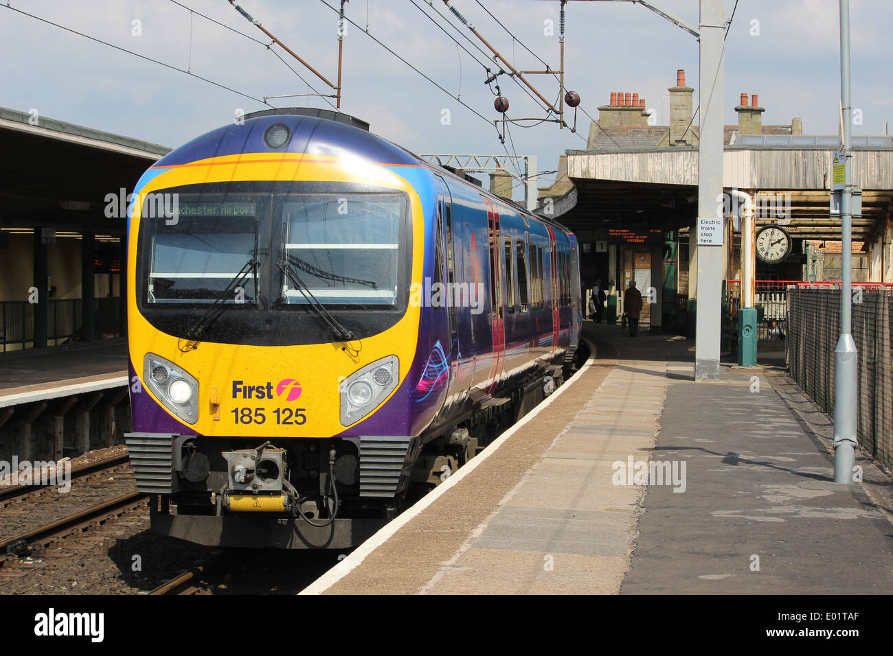 Diesel multiple unit train in platform 1 at Carnforth station with a service from Barrow-in-Furness to Manchester Airport Stock Photo