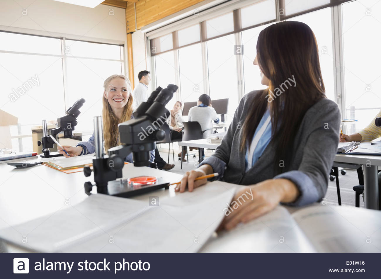 High school students with microscopes in classroom Stock Photo Alamy