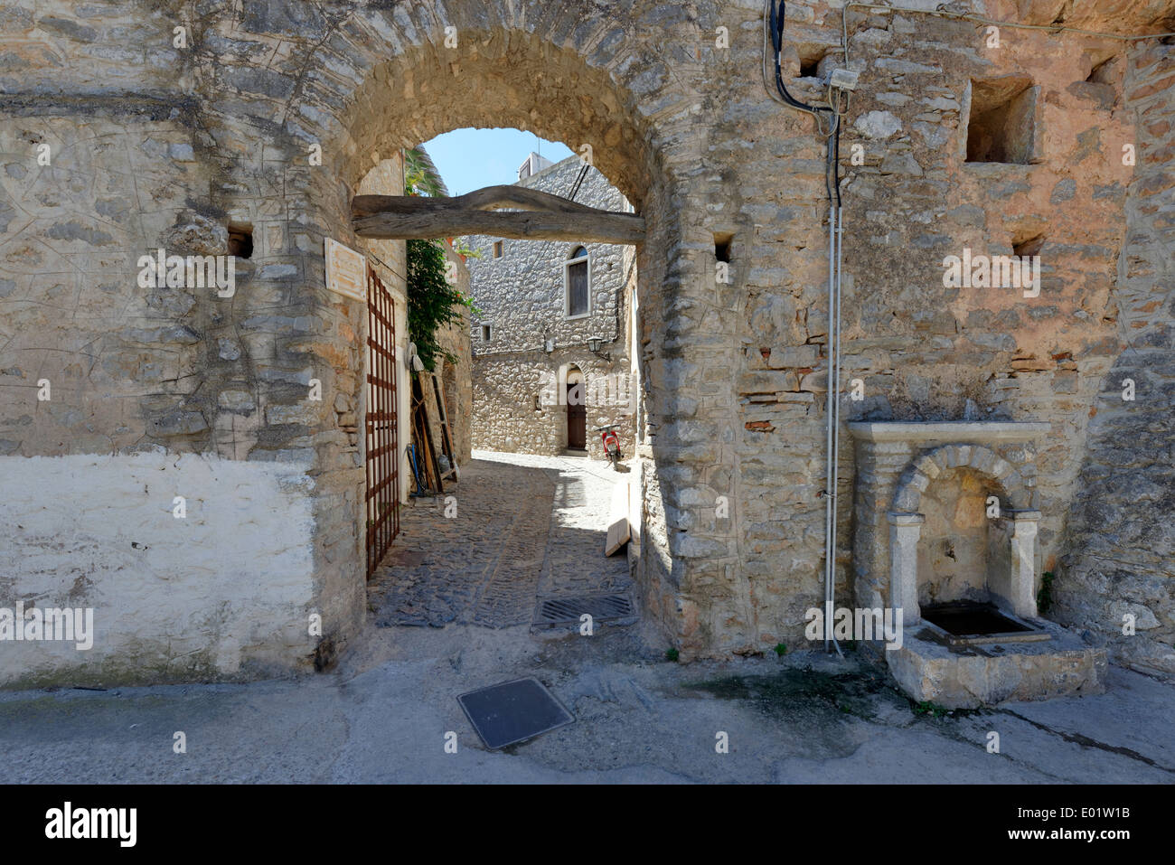 North West town gateway with original Iron Gate Medieval town Mesta Chios Greece shape fortifications town Stock Photo