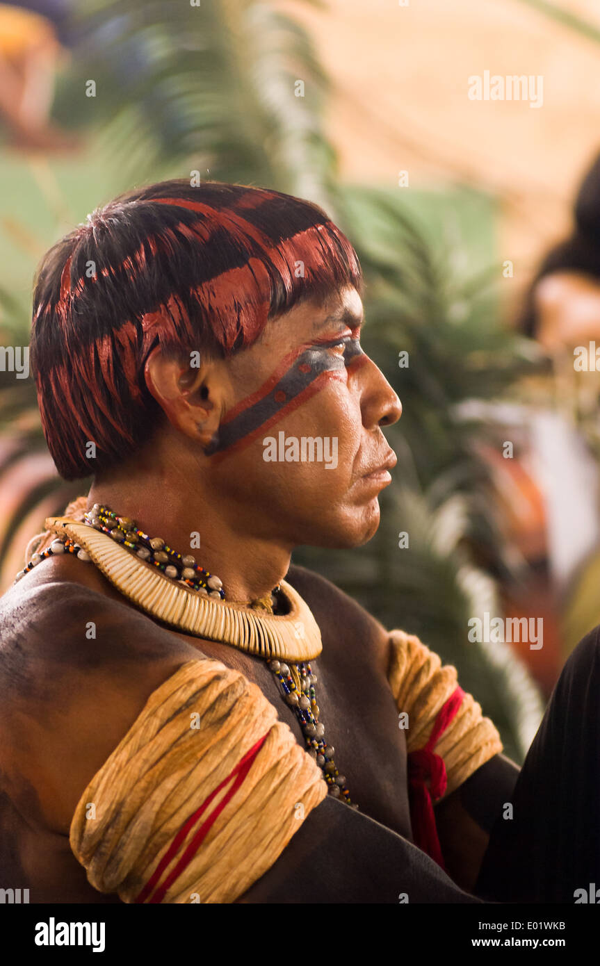 Altamira, Brazil. 'Xingu Vivo Para Sempre' protest meeting about the proposed Belo Monte hydroeletric dam and other dams on the Xingu river and its tributaries. Indian from the Alto Xingu, Xingu Indigenous Park with full ceremonial body face and hair paint looking angry . Stock Photo