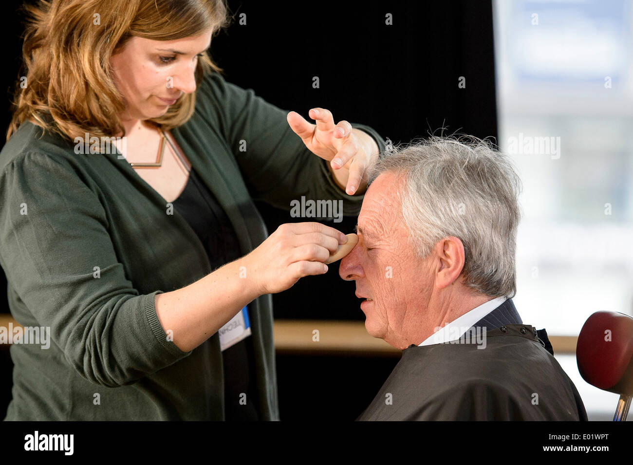 Brussels, Belgium. 29th April 2014. Jean-Claude Juncker, top candidate for European People's Party (EPP) receives the make-up ahead of Euranet's 'Big Crunch' Presidential debate at the EU parliament in BrusselsThe four top candidates for the presidency of the European Commission - Jean-Claude Juncker, Ska Keller, Martin Schulz and Guy Verhofstadt - attend EU-wide debate organized by EuranetPlus and focused on the major election topics. Credit:  dpa picture alliance/Alamy Live News Stock Photo