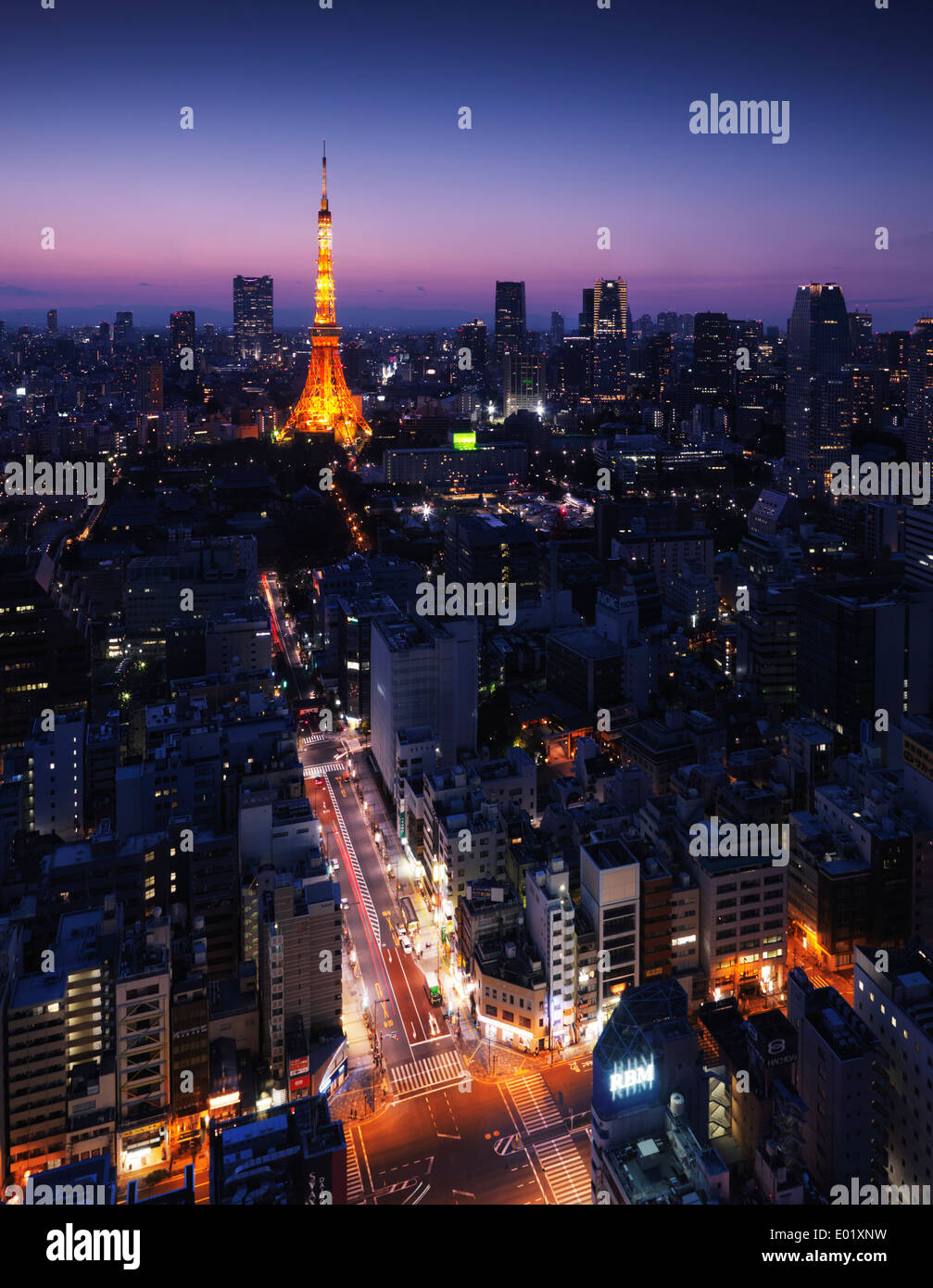 License available at MaximImages.com - Brightly lit Tokyo tower illuminated at nighttime in cityscape with colorful twilight skies. Tokyo, Japan Stock Photo