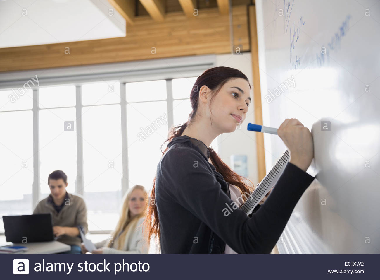 High school student at whiteboard in classroom Stock Photo